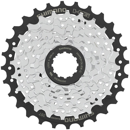 Shimano CS-HG400 cassette with multiple cogs for bicycle drivetrain, showing shiny metal teeth and gear structure.
