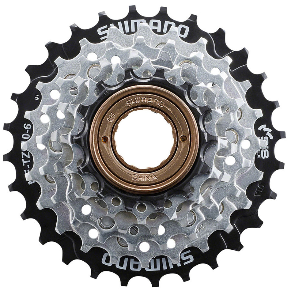 Shimano multi-speed freewheel with multiple cogs for bicycle drivetrain, shown in a close-up view.