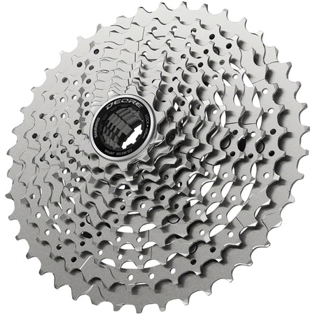 Shimano Deore M4100 cassette with multiple sprockets for mountain biking, mounted on a bicycle drivetrain.