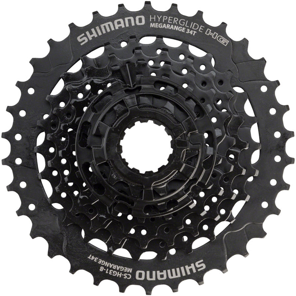 Shimano CS-HG31 8-speed cassette with steel cogs for mountain and road bikes, showing the gear sprockets and construction.