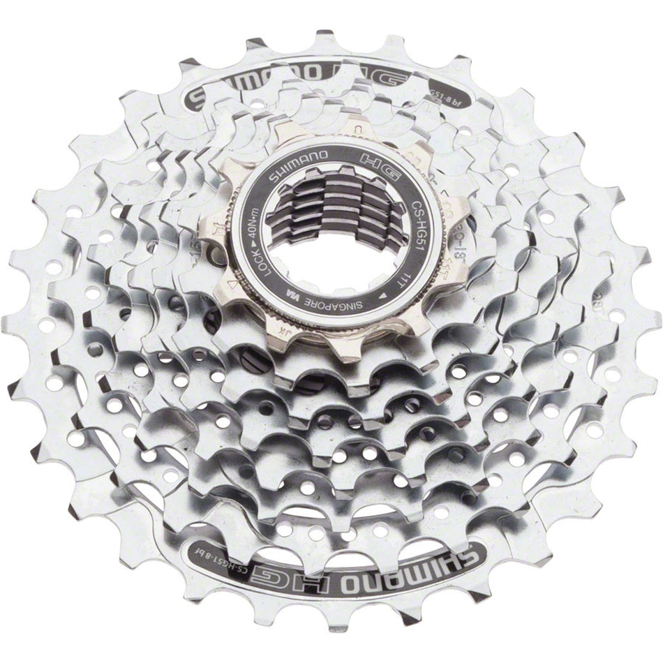Shimano CS-HG51 8-speed cassette with silver cogs for road and mountain bikes, showing the gear sprockets and teeth.