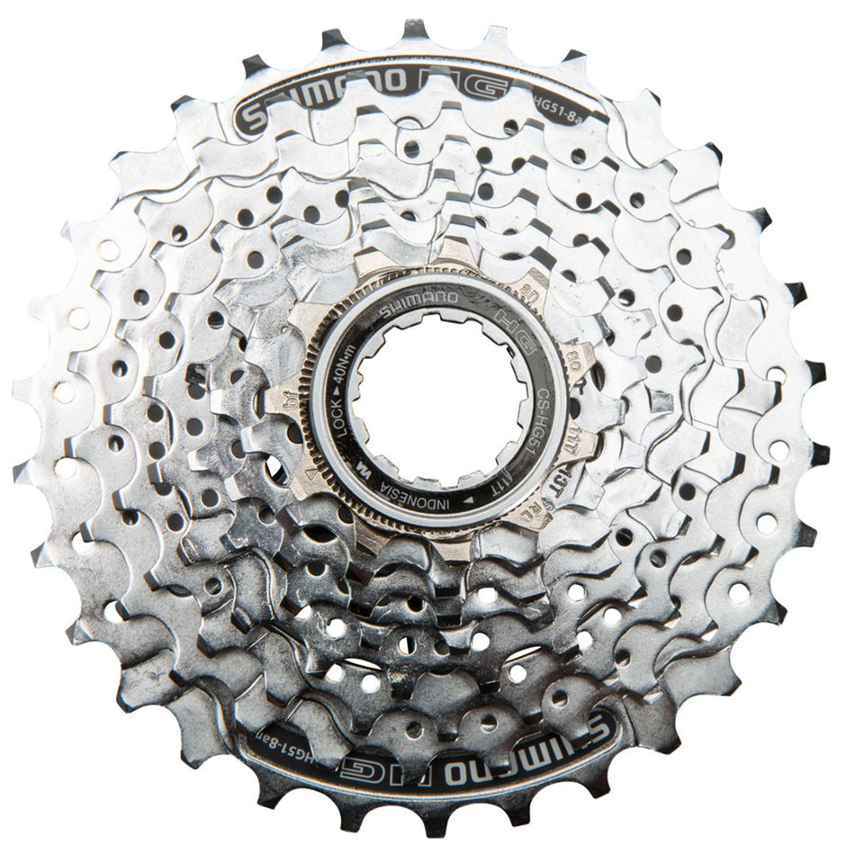 Shimano CS-HG51 8-speed cassette with metal cogs and black body, shown in a close-up view of the bike drivetrain component.