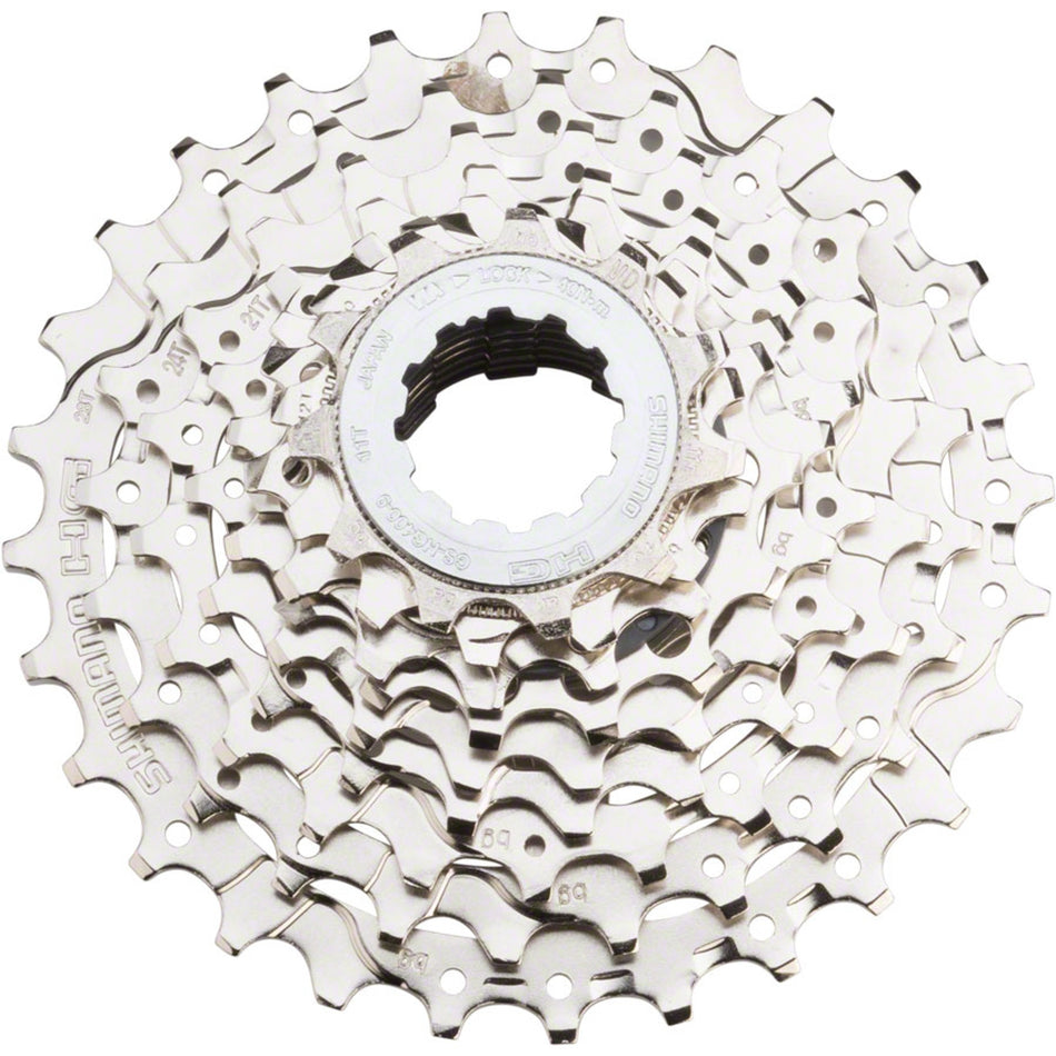 Shimano CS-HG400 9-speed cassette with black metal cogs for mountain or road bike gear shifting, close-up view of cogs.