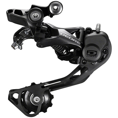 Shimano Deore RD-M6000 10-speed rear derailleur mounted on bike, showcasing gear mechanism and metallic finish.
