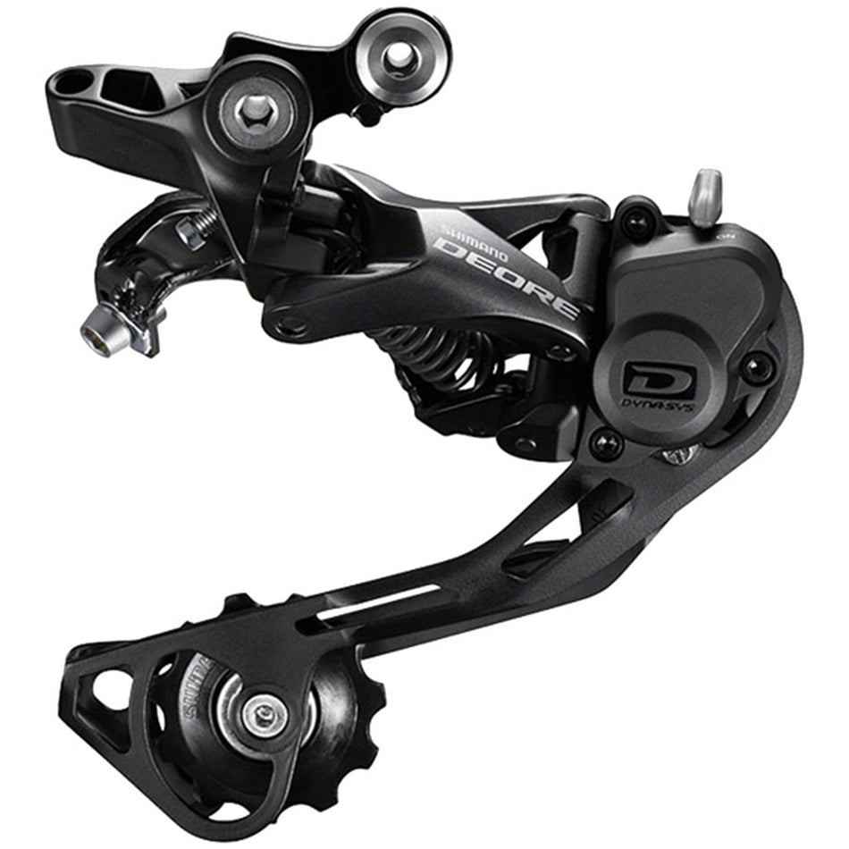 Shimano Deore RD-M6000 10-speed rear derailleur mounted on bike, showcasing gear mechanism and metallic finish.