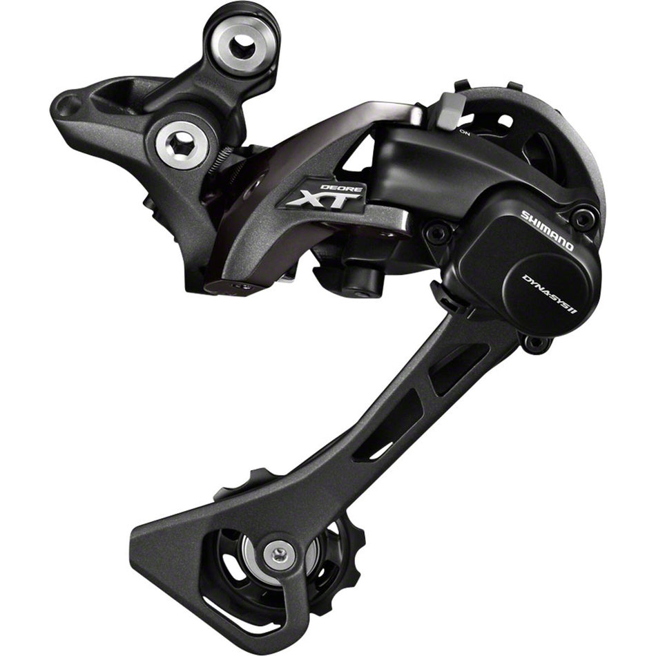 Shimano XT RD-M8000 rear derailleur mounted on bike, showing the durable metal construction and precise gear shifting mechanism.