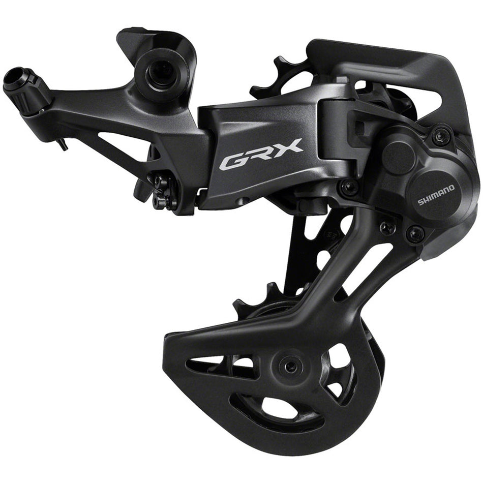Shimano GRX RD-RX822 12-speed rear derailleur with black body and metallic accents, mounted on a bicycle drivetrain.