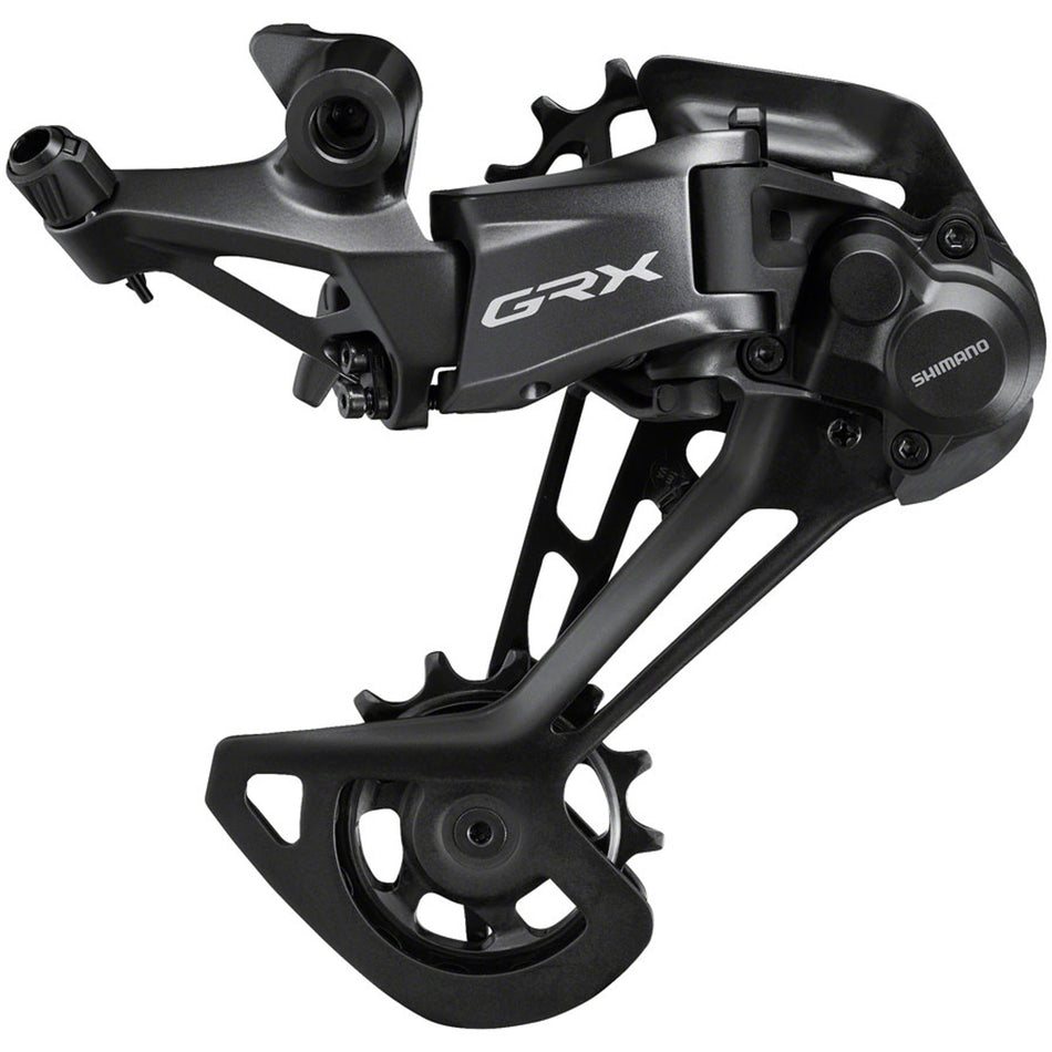 Shimano GRX RD-RX822 12-speed rear derailleur mounted on bicycle drivetrain for gravel and adventure riding.