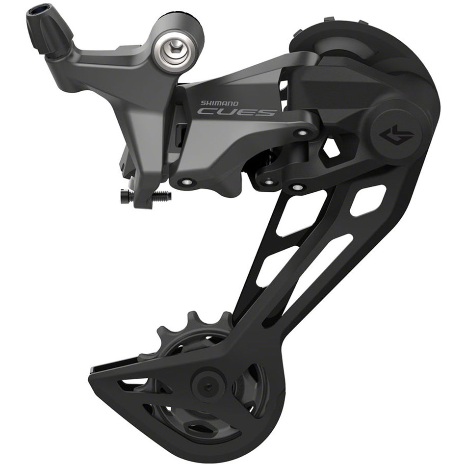 Shimano CUES RD-U6020 Linkglide rear derailleur mounted on a bike, showcasing its sleek design and construction.