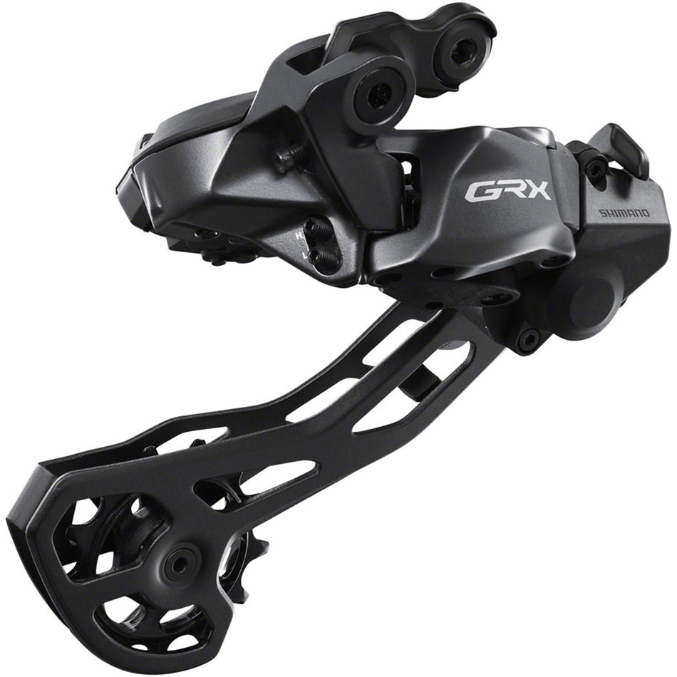 Shimano GRX RD-RX825 Di2 rear derailleur mounted on bicycle drivetrain for gravel riding, with metal cage and electronic shifting components.