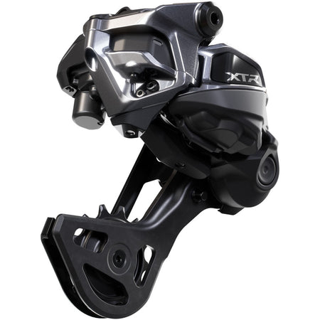 Shimano XTR RD-M9250-GS Di2 wireless rear derailleur mounted on a bike, showcasing sleek design and precise shifting capabilities.