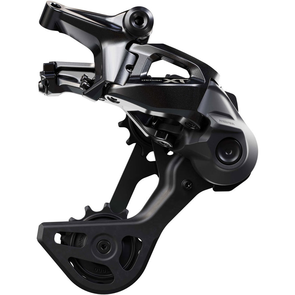 Shimano Deore XT RD-M8200 rear derailleur mounted on bike, showcasing its construction and gear attachment for mountain biking.