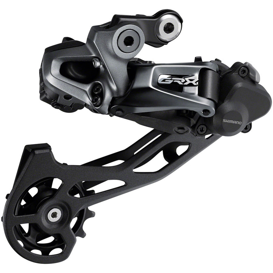 Shimano GRX RD-RX815 Di2 rear derailleur for gravel bikes, showing sleek black design and mounting hardware.