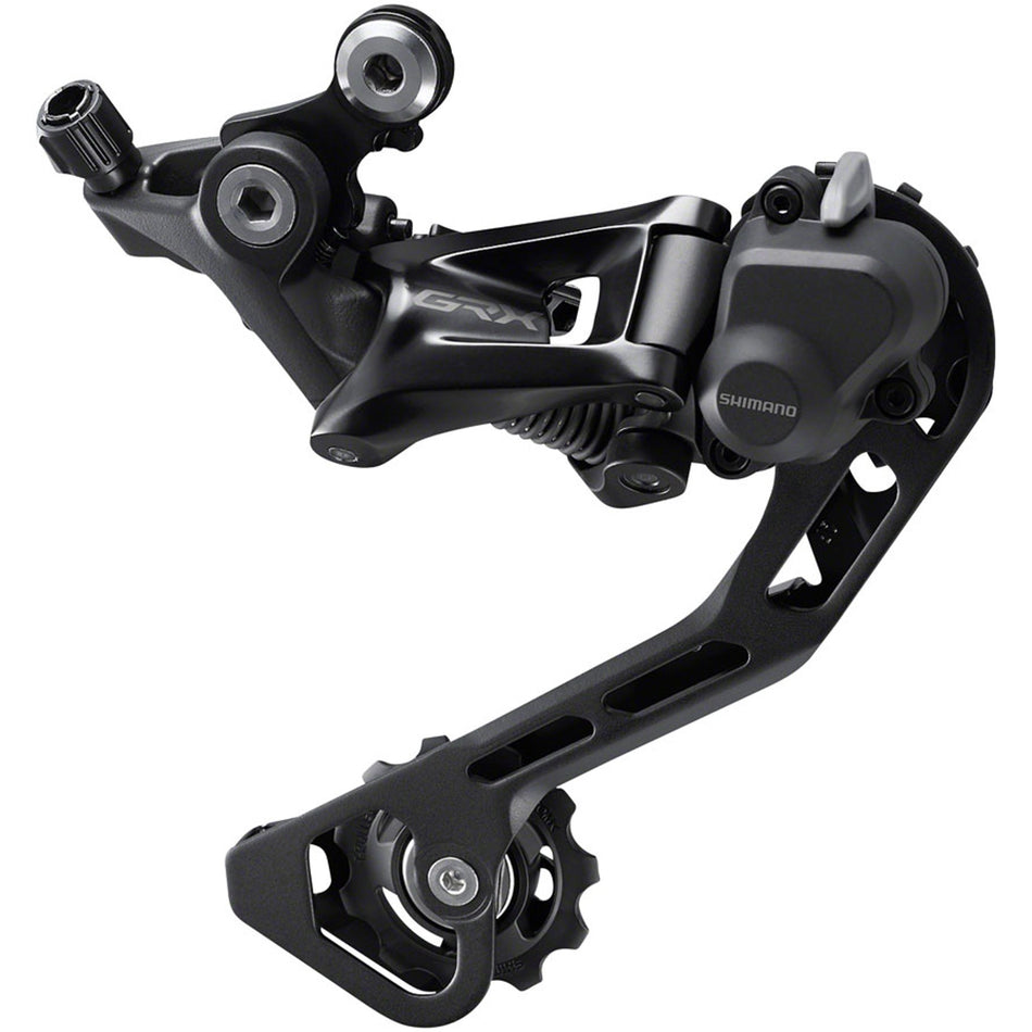 Shimano GRX RD-RX400 rear derailleur mounted on bike, showcasing durable, lightweight design for gravel and adventure cycling.