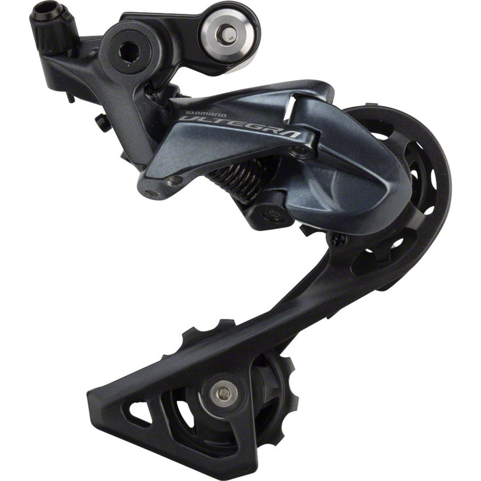 Shimano Ultegra RD-R8000 rear derailleur mounted on bike, showing sleek metal construction and precise gear shifting mechanism.
