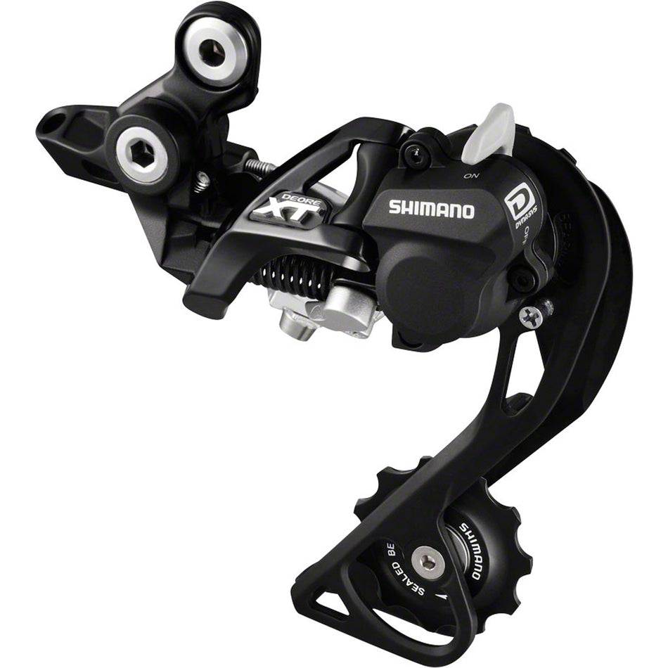 Shimano Deore XT RD-M780/M770 rear derailleur mounted on a bike, showcasing durable mountain bike gear shifting component.