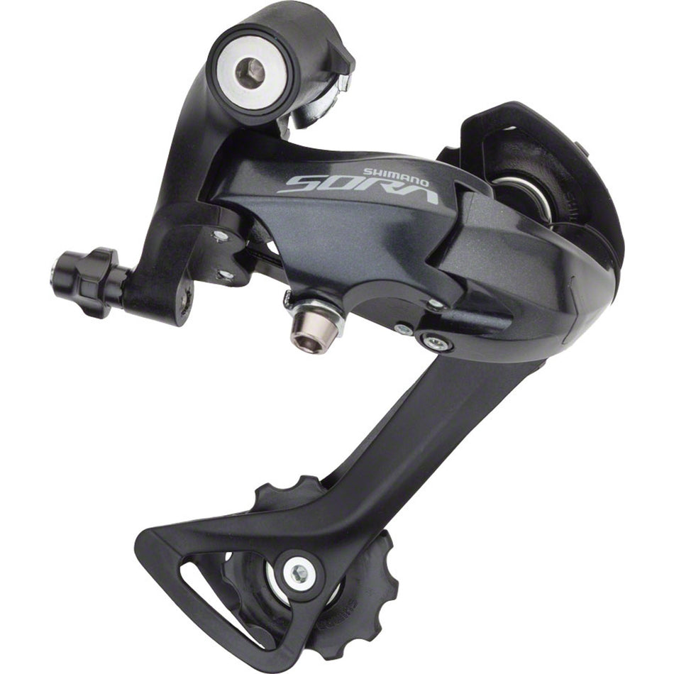 Shimano Sora RD-R3000 rear derailleur mounted on bicycle, showing sleek design and gear adjustment components.