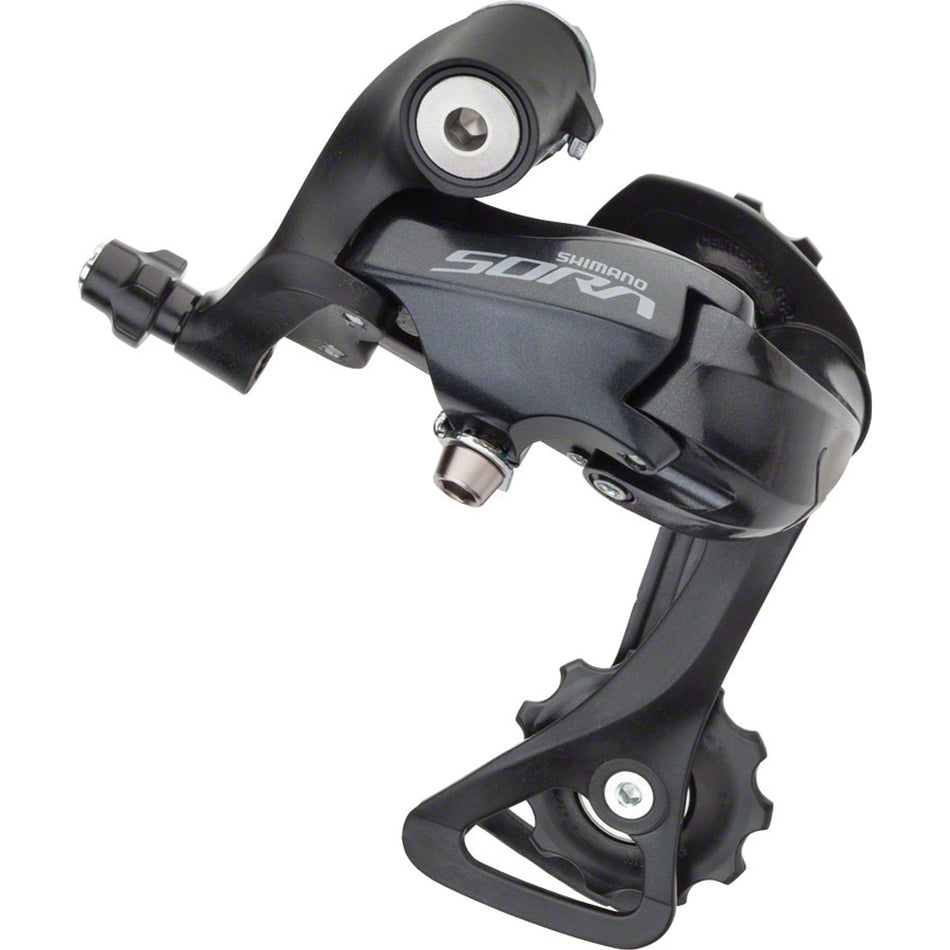 Shimano Sora RD-R3000 rear derailleur mounted on a bicycle, showcasing gear shifting components and design details.