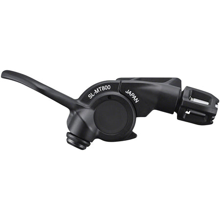 Shimano XTR SL-MT800 dropper seatpost lever attached to bike handlebar, showing ergonomic design for mountain biking suspension control.