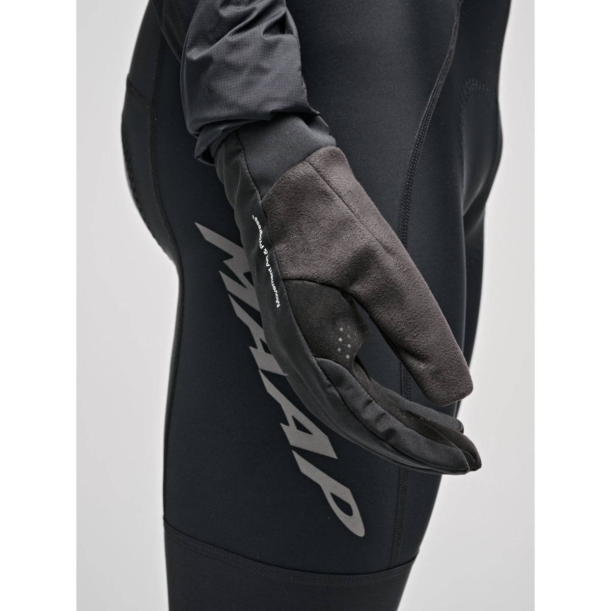 MAAP Control Winter Glove in black, insulated cycling glove shown in a winter lifestyle setting