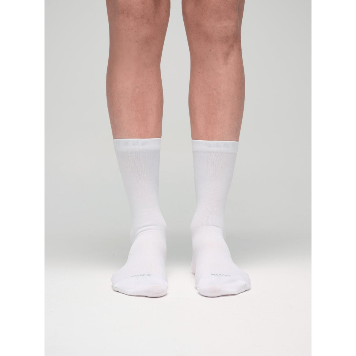 MAAP Team Long cycling sock in white, shown from the side with ribbed fabric and signature branding