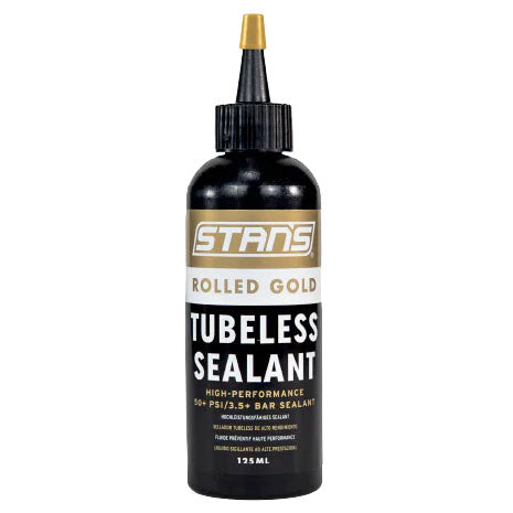 Stan's NoTubes rolled gold high pressure tubeless sealant in a container for tubeless bike wheel setups.